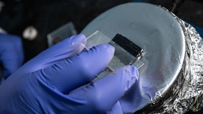 Rice University graduate student M.A.S.R. Saadi coats a compound of sulfur and selenium onto steel to test its ability to protect the surface from biotic and abiotic contaminants.