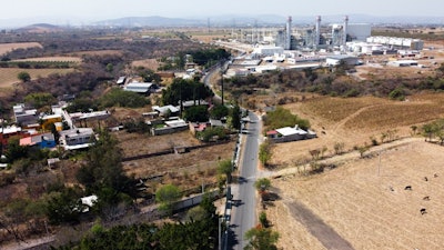 In this Feb. 22, 2020 file photo, a power generation plant stands idle near Huexca, Morelos state, Mexico. A constitutional reform presented by President Andrés Manuel López Obrador would cancel contracts under which some private power generating plants plants sell power into the national grid, declares “illegal” other private plants that sell energy direct to corporate clients in Mexico and would cancel many long-term energy supply contracts and clean-energy preferential buying schemes.