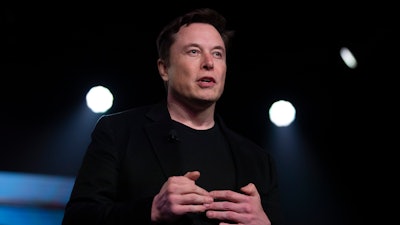 In this March 14, 2019, file photo, Tesla CEO Elon Musk speaks before unveiling the Model Y at the company's design studio in Hawthorne, Calif. Tesla says it will relocate its headquarters from Palo Alto, Calif., to Austin, Texas, though the electric car maker will keep expanding its manufacturing capacity in the Golden State.