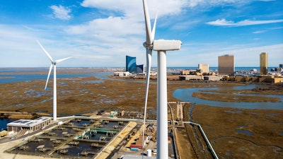 Wind turbines spin to generate electrical power in Atlantic City, N.J., on Wednesday, Feb. 17, 2021. A report released Tuesday, Oct. 12 by a group studying the economics of the offshore wind industry predicts that the industry’s supply chain will be worth $109 billion over the next decade.
