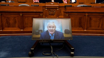 Darren Woods, CEO of ExxonMobil testifies via video conference during a House Committee on Oversight and Reform hearing on the role of fossil fuel companies in climate change, Thursday, Oct. 28, 2021, on Capitol Hill in Washington.