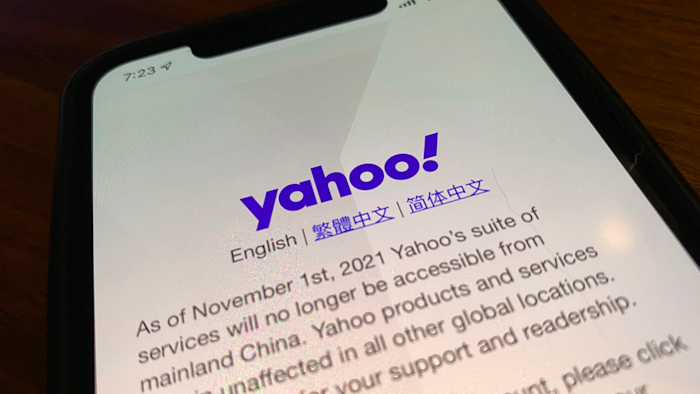 A smart phone shows the home page of Yahoo when accessed inside China in Beijing, China, Tuesday, Nov. 2, 2021. Yahoo Inc. on Tuesday said it plans to pull out of China, citing an 'increasingly challenging business and legal environment.'