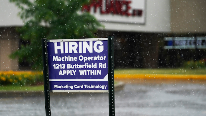 A hiring sign is displayed in Downers Grove, Ill., on June 24, 2021. The number of Americans applying for unemployment benefits fell to a fresh pandemic low last week, Thursday, Nov. 4, another sign the job market is healing after last year’s coronavirus recession. Jobless claims dropped by 14,000 to 269,000 last week.