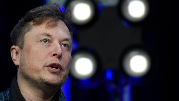 Tesla and SpaceX Chief Executive Officer Elon Musk speaks at the SATELLITE Conference and Exhibition in Washington on March 9, 2020. After making a promise on Twitter, the Tesla CEO has sold about 900,000 shares of the electric car maker's stock, netting over $1.1 billion that will go toward paying tax obligations for stock options.