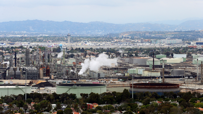 This aerial photo shows the Standard Oil Refinery in El Segundo, Calif., with Los Angeles International Airport in the background and the El Porto neighborhood of Manhattan Beach, Calif., in the foreground, May 25, 2017.