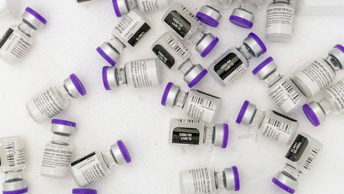Vials of the Pfizer-BioNTech COVID-19 vaccine sit in a cooler before being thawed at a pop-up COVID-19 vaccination site in the Bronx borough of New York on Tuesday, Jan. 26, 2021. On Tuesday, Nov. 9, 2021, Pfizer asked U.S. regulators to allow boosters of its COVID-19 vaccine for anyone 18 or older.