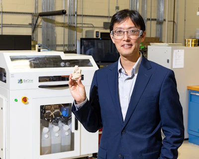 Oak Ridge National Laboratory scientist Tomonori Saito shows a 3D-printed sandcastle at the DOE Manufacturing Demonstration Facility at ORNL.