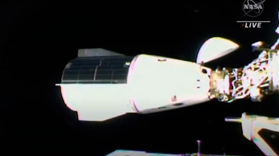 This image from video provided by NASA shows the SpaceX Dragon docking with the International Space Station, Thursday, Nov. 11, 2021. A SpaceX capsule carrying four astronauts pulled up Thursday at the International Space Station, their new home until spring. It took 21 hours for the flight from NASA’s Kennedy Space Center to the glittering outpost.