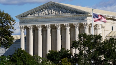 The Supreme Court is seen in Washington on Oct. 18, 2021. The Supreme Court has turned away appeals from Volkswagen that sought to stop state and local lawsuits related to the 2015 scandal in which the automaker was found to have rigged its vehicles to cheat U.S. diesel emissions tests. The court’s action Monday allows suits by Ohio, Salt Lake County, Utah, and the environmental protection agency in Hillsborough County, Florida, to continue.