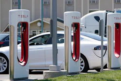 A Tesla charges at a station in Topeka, Kan., April 5, 2021. President Joe Biden and Democrats in Congress are looking to give U.S. automakers with union employees the inside track when it comes to winning the burgeoning electric vehicle market.