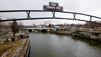 This Jan. 26, 2016, file photo, shows the Flint River in Flint, Mich. A judge on Wednesday, Nov. 10, 2021, approved a $626 million settlement for Flint residents and others who were exposed to lead-contaminated water.