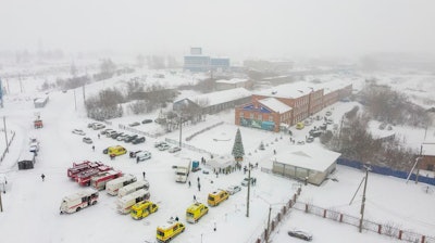 Ambulances and fire trucks are parked near the Listvyazhnaya coal mine out of the Siberian city of Kemerovo, about 3,000 kilometres (1,900 miles) east of Moscow, Russia, Thursday, Nov. 25, 2021.
