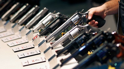 Handguns displayed at the Smith & Wesson booth at the Shooting, Hunting and Outdoor Trade Show in Las Vegas, Jan. 19, 2016.