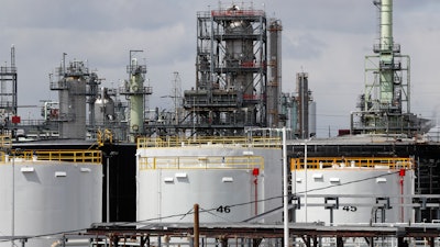 Storage tanks are shown at a refinery in Detroit, Tuesday, April 21, 2020. The White House on Tuesday said it had ordered 50 million barrels of oil released from strategic reserve to bring down energy costs.