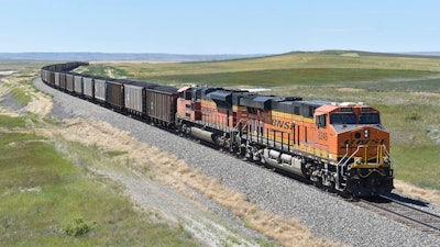 A BNSF railroad train hauling carloads of coal from the Powder River Basin of Montana and Wyoming is seen east of Hardin, Mont., on July 15, 2020. BNSF Railway has gone to court to determine whether it has the authority to require all its employees to get vaccinated against the coronavirus.
