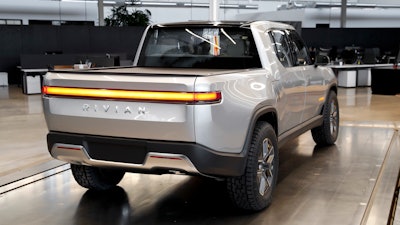 This Nov. 14, 2018, file photo shows a Rivian R1T at Rivian headquarters in Plymouth, Mich. Shares in Rivian Automotive are set to trade publicly on Wednesday, Nov. 10, 2021, and the world should get a better idea of just how hot investors are for the electric vehicle market.