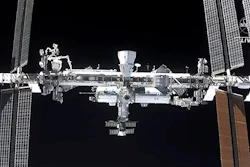 This image made from NASA TV shows the international space station, seen from the SpaceX Crew Dragon spacecraft Saturday, April 24, 2021. NASA called off a spacewalk Tuesday, Nov. 30, because of menacing space junk that could puncture an astronaut's suit or damage the International Space Station.