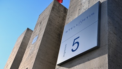 A view of the Stellantis logo on a building of the historic Mirafiori headquarters in Turin, Italy, Jan. 18, 2021. The Stellantis carmaker has secured a five-year supply of battery-grade lithium hydroxide in Europe supporting its plans to convert to 98% electrified vehicles by 2025, the company said Monday, Nov. 29, 2021. (Marco Alpozzi/LaPresse via AP, file
