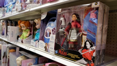 A doll based on the upcoming Walt Disney Studios film 'Mulan' is displayed in the toy section of a Target department store, April 30, 2020, in Glendale, Calif. As supply chain bottlenecks create shortages on many items, some charities are struggling to secure holiday gift wishes from kids in need.