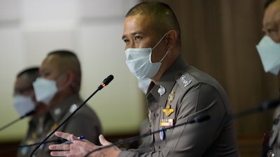 Commissioner of Central Investigation Bureau Jirabhob Bhuridej holds a press conference in Bangkok, Thailand, Wednesday, Nov. 3, 2021. The commissioner announced that they have arrested the head of a company suspected of cheating overseas buyers of medical rubber gloves during the coronavirus pandemic.