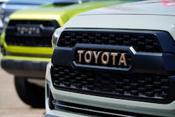 The company logo highlights the grille of a 2021 Tacoma pickup truck on display in the Toyota exhibit at the Denver auto show Friday, Sept. 17, 2021, at Elitch's Gardens in downtown Denver. Japan’s top automaker Toyota reported Thursday, Nov. 4, 2021, a 33% jump in second fiscal quarter profit, as it raised its full year forecast, despite supply chain woes related to the coronavirus pandemic.