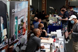 In this Sept. 22, 2021, file photo, prospective employers and job seekers interact during a job fair in the West Hollywood section of Los Angeles. California has been averaging more than 100,000 new jobs each month since February. New data released Friday, Oct. 22, 2021, by the U.S. Bureau of Labor Statistics shows California is now tied with Nevada for the highest unemployment rate in the country at 7.5%.