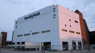Federal workplace safety regulators announced Monday, Nov. 15, 2021, they have reached an agreement with Smithfield Foods to settle a contested citation of the company's coronavirus safety measures during a massive outbreak last year at a South Dakota pork processing plant.