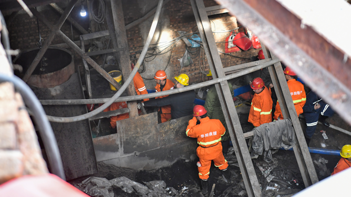 More than 20 people were trapped after a coal mine was flooded in the city of Xiaoyi, north China's Shanxi province, as a result of illegal mining, local authorities said Thursday.