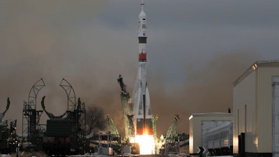 The Soyuz-2.1a rocket booster blasts off at the Baikonur cosmodrome, Kazakhstan, Dec. 8, 2021