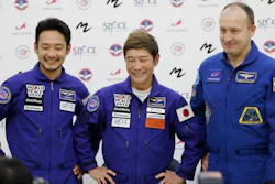 Roscosmos cosmonaut Alexander Misurkin, right, space flight participants Yusaku Maezawa, center, and Yozo Hirano attend a news conference at the Gagarin Cosmonauts' Training Center outside Moscow, Oct. 14, 2021.