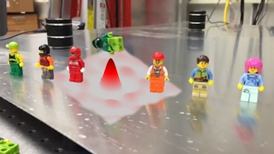 Time reversal technique focuses wave energy to knock over minifig targets in museum demonstration.