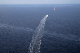 Federal prosecutors say a New Orleans-based company has agreed to turn over a $432 million trust fund and pay $43 million to settle a lawsuit over cleaning up the nation's longest-running oil spill.