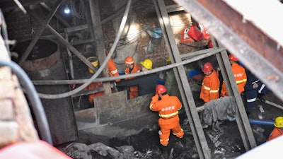 More than 20 people were trapped after a coal mine was flooded in the city of Xiaoyi, north China's Shanxi province, as a result of illegal mining, local authorities said Thursday.