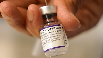 Pfizer said Wednesday, Dec. 8, 2021, that a booster dose of its COVID-19 vaccine may protect against the new omicron variant even though the initial two doses appear significantly less effective.