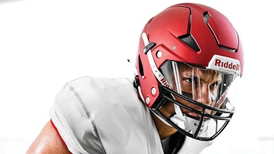 Riddell's Tru-Fit System utilizes Riddell's Verifyt scanning app to capture a 3D image of an athlete's head. A fitting algorithm generates a custom combination of energy managing interior pads that create a personalized interior fit and protection system.