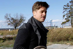 Brad Pitt walks past one of the first homes built in New Orleans by his Make It Right Foundation in this 2008 photo.