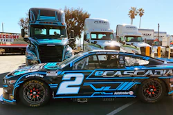 The No. 2 Ford sits in front of the Team Penske fully electric Freightliner eCascadia hauler, Penske Truck and Leasing, Ontario, Calif., Feb. 3, 2022.