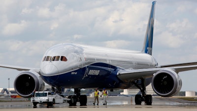 In this Friday, March 31, 2017, file photo, Boeing employees walk the new Boeing 787-10 Dreamliner down towards the delivery ramp area at the company's facility in South Carolina after conducting its first test flight at Charleston International Airport in North Charleston, S.C. Federal safety officials aren't ready to give back authority for approving new planes to Boeing when it comes to the large 787 jet, which Boeing calls the Dreamliner, Tuesday, Feb. 15, 2022. The plane has been plagued by production flaws for more than a year.