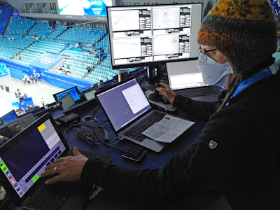 Associated Press photographer Jeff Roberson triggers robotic cameras at figure skating on Feb. 8, 2022, in Beijing.