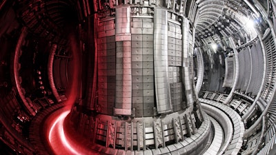 Nuclear fusion facility: JET interior with superimposed plasma.
