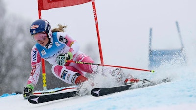 Skiers and snowboarders in downhill racing events, like U.S. Olympian Mikaela Shiffrin, often prefer the harder, faster artificial snow over natural snow.