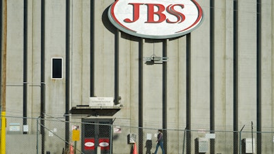 Meatpacking giant JBS has agreed to a $52.5 million settlement in a beef price-fixing lawsuit, Thursday, Feb. 3, 2022, that some say supports their concerns about how the lack of competition in the industry affects prices.