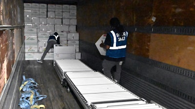 The first boxes of the Johnson & Johnson COVID-19 vaccine are loaded into a truck for shipment from the McKesson facility in Shepherdsville, Ky., Monday, March 1, 2021. As demand for COVID-19 vaccines collapses in many areas of the U.S., states are scrambling to use stockpiles of doses before they expire and have to be added to the millions that have already gone to waste.