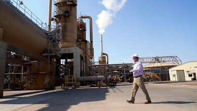 Derek Benson, chief operating officer of EnergySource Minerals, walks through the Featherstone plant in Calipatria, Calif., where the company is producing geothermal energy and extracting lithium from brine Friday, July 16, 2021. Benson says EnergySource Minerals has extracted lithium there on a small scale since 2016 and the company has plans to build a much larger addition for mineral extraction.