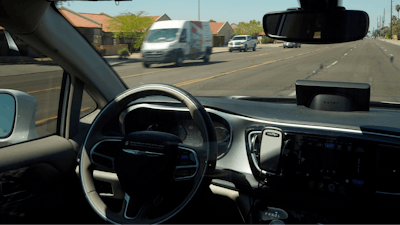 In this April 7, 2021 file photo, a Waymo minivan moves along a city street as an empty driver's seat and a moving steering wheel drive passengers during an autonomous vehicle ride in Chandler, Ariz. A small maker of autonomous vehicle systems could be in hot water with U.S. highway safety regulators over how quickly it reported the crash of a test vehicle last fall. The National Highway Traffic Safety Administration says in documents released Monday, March 28, 2022 that it's investigating Pony.ai's reporting of an Oct. 28 crash in Fremont, California.