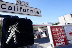 A California street sign is shown next to the price board at a gas station in San Francisco, on March 7, 2022. The average U.S. price of regular-grade gasoline shot up a whopping 79 cents over the past two weeks to $4.43 per gallon. Industry analyst Trilby Lundberg of the Lundberg Survey says Sunday, March 13, the new price exceeds by 32 cents the prior record high of $4.11 set in July 2008. Lundberg said gas prices are likely to remain high in the short term as crude oil costs soar amid global supply concerns following Russia's invasion of Ukraine. Nationwide, the highest average price for regular-grade is in the San Francisco Bay Area, at $5.79.
