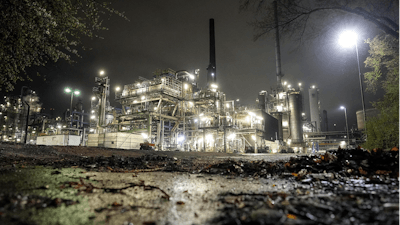 A refinery is illuminated in Gelsenkirchen, Germany, Tuesday evening, April 5, 2022. European governments were poised to ban on Russian coal imports despite the near-certainty of higher utility bills and inflation. But the limited energy sanction only underlined inability to agree on a much more sweeping ban on oil and gas that would hit Russia much harder but risk inflation and recession at home.