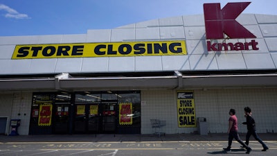 People walk into a Kmart in Avenel, N.J., Monday, April 4, 2022. When the New Jersey store closes its doors on April 16, it will leave only three remaining U.S. locations for the former retail powerhouse. It's a far cry from the chain's heyday in the 1980s and ‘90s when it had more than 2,000 stores and sold product lines endorsed by Martha Stewart and former “Charlie's Angel” Jaclyn Smith.