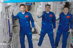 In this photo released by Xinhua News Agency, screen image captured at Beijing Aerospace Control Center in Beijing, China on Oct. 16, 2021, shows three Chinese astronauts, from left, Ye Guangfu, Zhai Zhigang and Wang Yaping waving after entering the space station core module Tianhe. Three Chinese astronauts returned to Earth on Saturday, April 16, 2022, after six months aboard China's newest space station in the longest crewed mission to date for its ambitious space program.