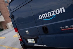 The company logo graces one of the doors of a delivery van for Amazon Wednesday, Sept. 1, 2021, in Denver. Amazon said Wednesday, April 13, 2022 it will add a 5% “fuel and inflation surcharge” to fees it charges third-party sellers who use the retailer’s fulfillment services as the company faces rising costs. The company said in an announcement on its website that the added fees will take effect on April 28 and are subject to change. Federal data released Tuesday showed inflation hit 8.5% in March, its fastest pace in more than 40 years.